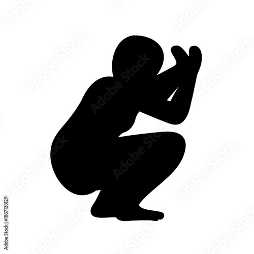 Silhouette of a person squatting with their hands in front of them