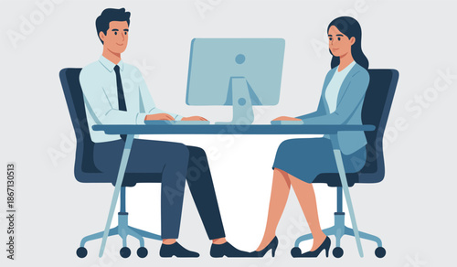 Business professionals sitting at desk working together on computer in modern office setting