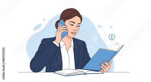 Professional woman in a dark blue suit talking on a smartphone while intently reading information from an open book at her desk.
