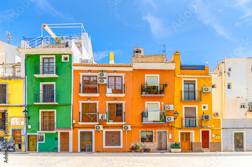 Villajoyosa old town small empty square, typical colorful houses traditional multicolored buildings in sunny summer day, La Vila Joiosa city historical centre Casco Antiguo, Alicante province, Spain