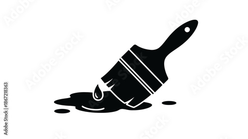 Black paintbrush with dripping paint