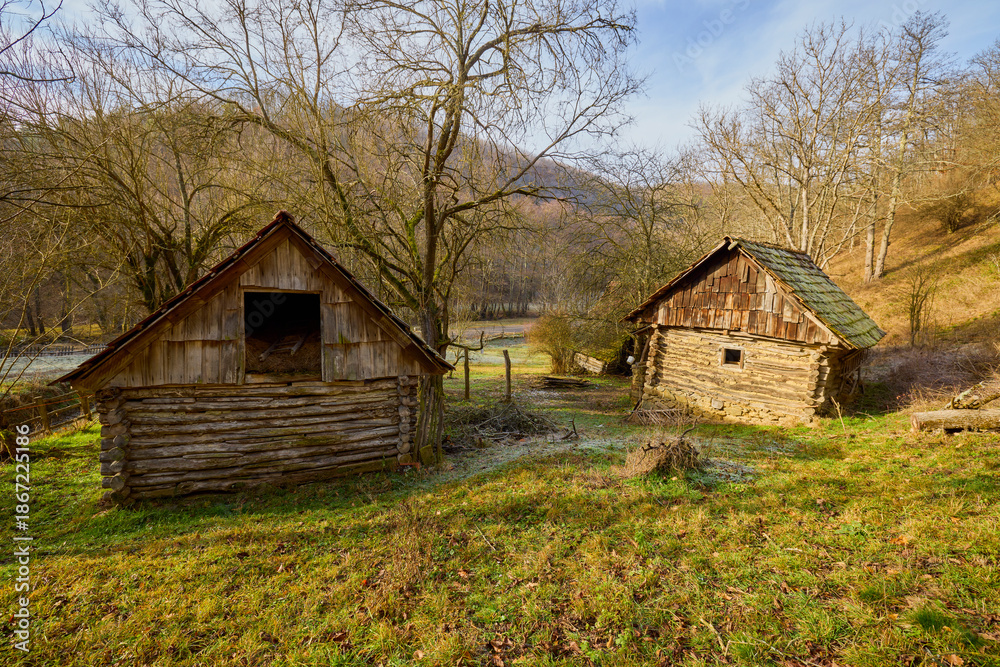 Obraz premium landscape with old wooden houses in the mountains in the Banat area of ​​Romania
