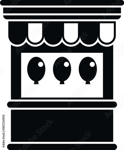 Amusement park carnival game booth displaying balloons for a shooting challenge