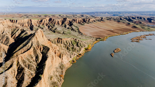 Drone aerial panorama Barrancas de Burujón Toledo cliffs lake sunny tourism travel landscape