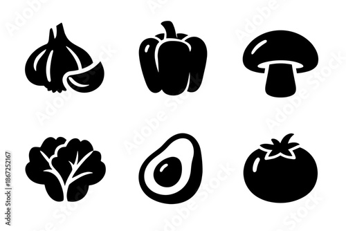 Vegetables food icon collection in black. Set of garlic, bell pepper, mushroom, leafy greens, avocado, tomato