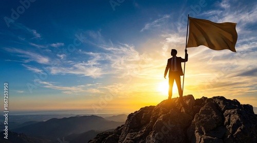 Silhouette of businessman holding flag on the top of mountain with over blue sky and sunlight leadership successful achievement with goal and objective target.