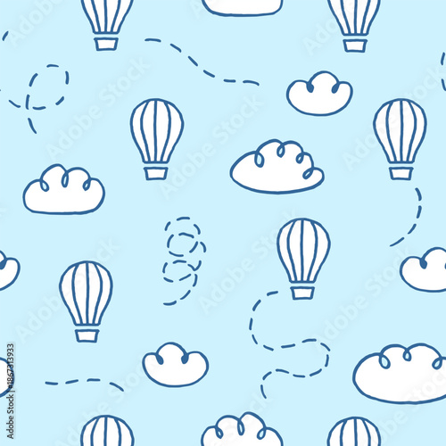 Vector seamless pattern with freehand drawn cartoon hot air balloons and clouds on blue background