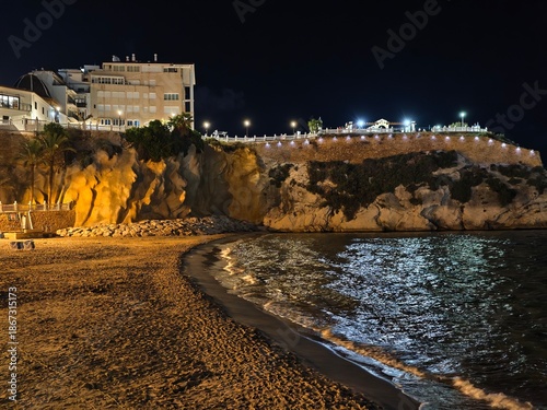 Bild auf Leinwand beach night allure, nighttime seaside landscape featuring luminous hotels and re