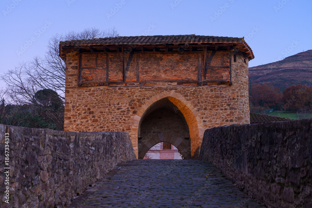 Fototapeta premium Old bridge of Muza in the beautiful village of Balmaseda at night, Vizcaya, Basque country, Spain.