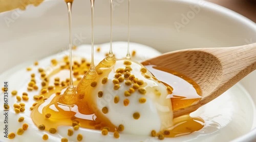 Honey Dripping onto Yogurt with Pollen.