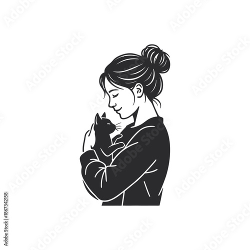 Woman holding a cat in her arms with love and affection.
