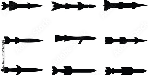 various black silhouettes of rockets and missiles on white background