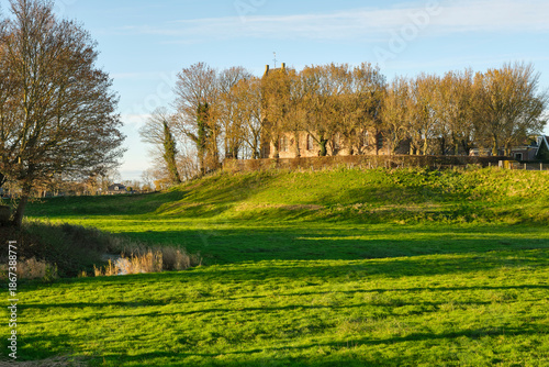 Foto 12th century church on top of the historic mound of Hegebeintum in Friesland The Netherlands