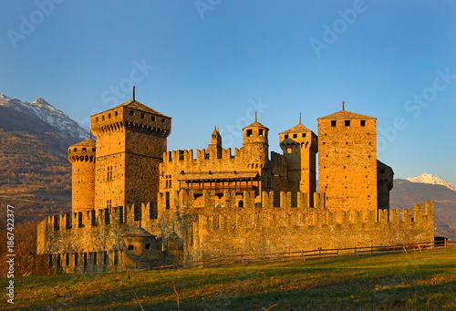 Fenis Castle in Aosta Valley at sunset. Fenis Castle is one of the castles guarding the Aosta Valley. Aosta Valley in Italy is full of medieval castles.