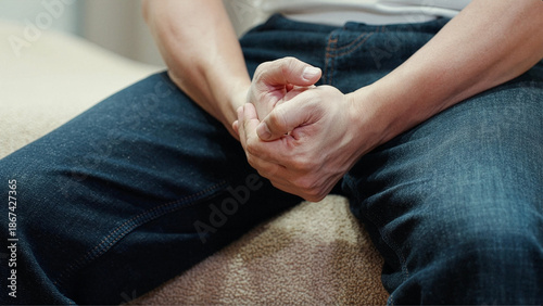 Photography Close up of man with clenched fists showing stress, anxiety and emotional tension