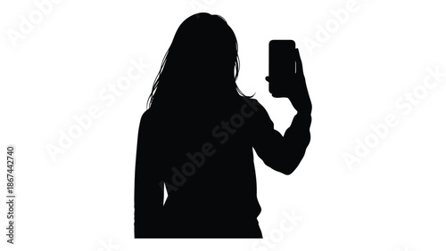 Silhouette of a woman taking a self portrait with a smartphone device