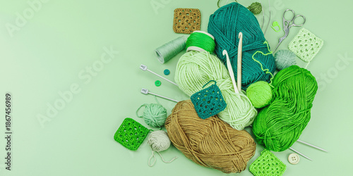 A set of knitting yarn and tools in spring colors. Handmade concept, creative art, crafting process
