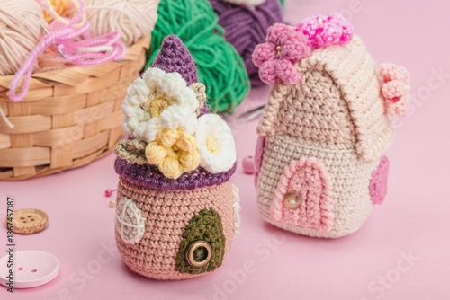 Handmade spring decor concept. Creative crocheting, house figurines, traditional flowers and stuff