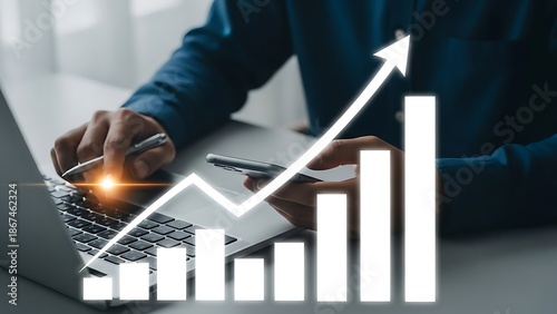 Businessman Analyzing Growing Graph on Laptop in Office