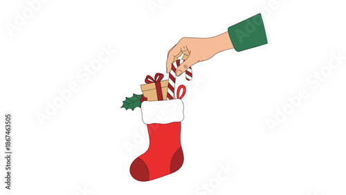 Hand stuffing a red Christmas stocking with small gifts, including a wrapped present, a candy cane, and a sprig of holly.