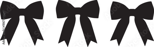 Three black bows with long tails on white background silhouette