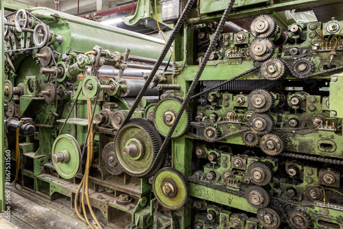 Obraz na plátně Complex vintage industrial machine with gears, chains, and belts