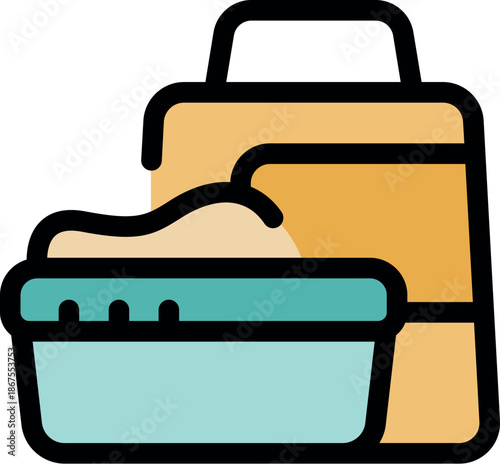 Clean cat litter box being filled with fresh sand from its bag, ensuring a hygienic environment for the pet