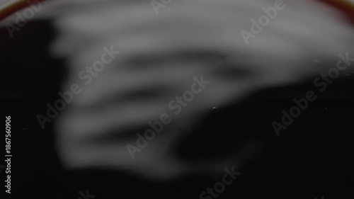 Wallpaper Mural Abstract macro top view seamless loop of the glossy surface of intensely black coffee subtly reflecting ambient light while gently rippling and settling digital display, beverage, modern Torontodigital.ca