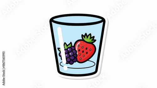 A clear glass contains a strawberry and blackberries