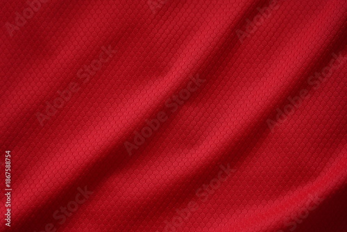 Close up of red football jersey sports clothing fabric texture.