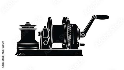 Black silhouette of a manual fishing winch on a isolated on white background