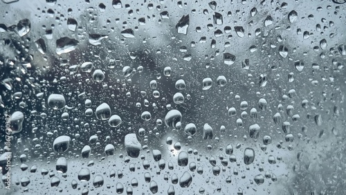 Wallpaper Mural Raindrops on glass window with blurred background, water droplets, and condensation. Weather and rain, moisture, and transparency. The concept of rain and weather effects. Torontodigital.ca