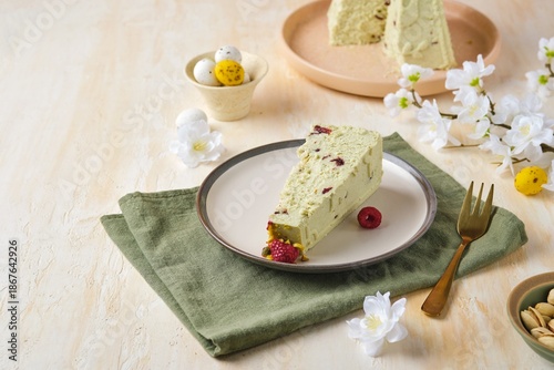 Step-by-step preparation of a cottage cheese Easter dessert in the shape of a truncated cone with pistachio paste, white chocolate and dried cranberries.