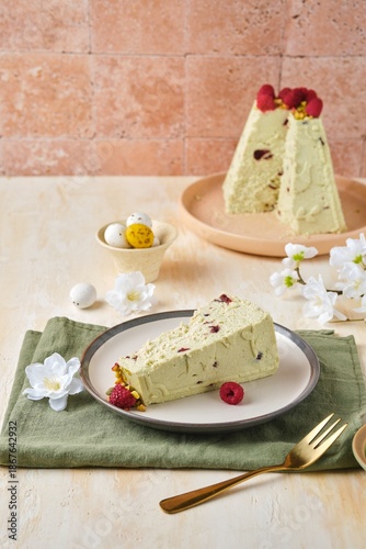 Step-by-step preparation of a cottage cheese Easter dessert in the shape of a truncated cone with pistachio paste, white chocolate and dried cranberries.