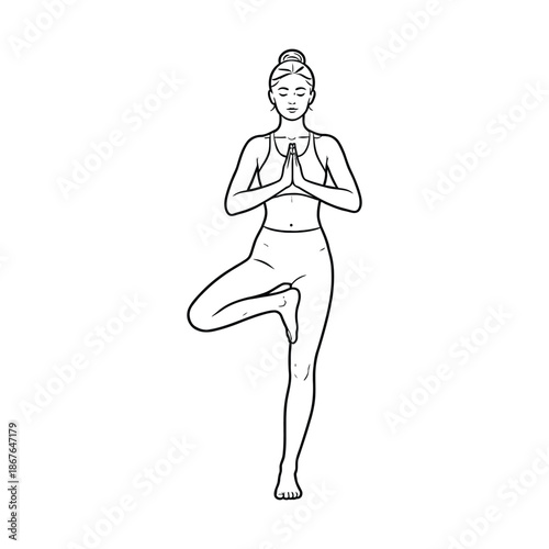 Woman in yoga tree pose with hands pressed together in prayer vrikshasana exercise de