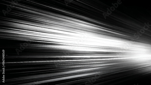Abstract light streaks radiating from a central point on a dark background  speed motion effect