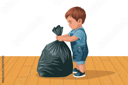 A young boy in blue overalls holding a large black trash bag on a wooden floor