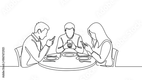 People seated around a table engrossed in their mobile phones