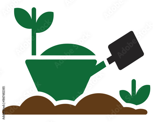 A green teapot is watering a small plant growing in the soil.