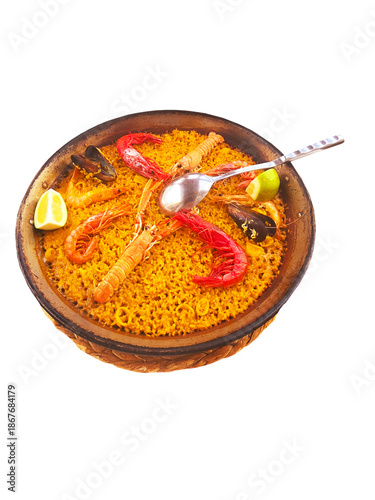 Seafood paella isolated. Traditional Spanish rice dishes. Rice, prawns and mussels. Healthy eating on the Mediterranean Sea. Clipping path. Spain, Costa Blanca, Alicante.