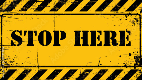 Grungy Yellow and Black 'STOP HERE' Industrial Warning Sign with Hazard Stripes and Distressed Texture