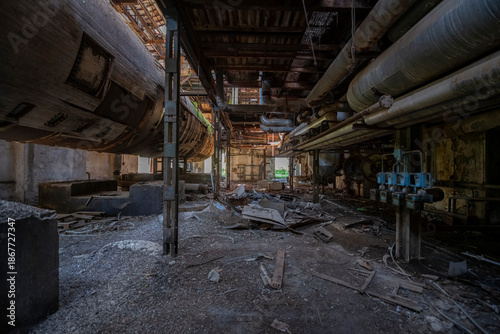 Abandoned sugar factory in Italy. Industrial ruins, derelict refinery interior, and urban exploration (urbex) photography