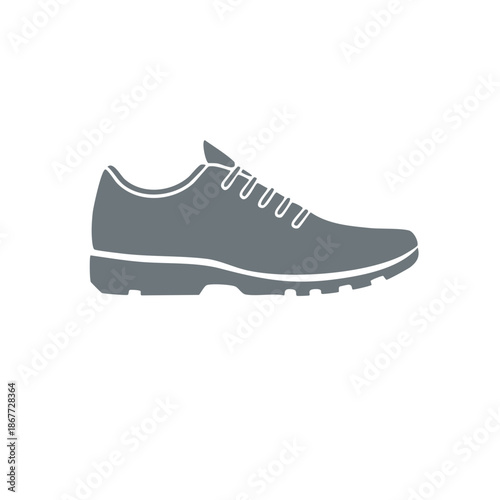 Silhouette of running shoe with laces and textured sole for sport or fitness