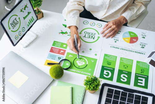 Tableau sur toile Business person examines environmental social governance ESG data net zero strat