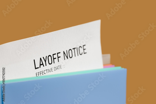 Fotografija Concept of employee Lay off notice by mail and marked effective date on brown background