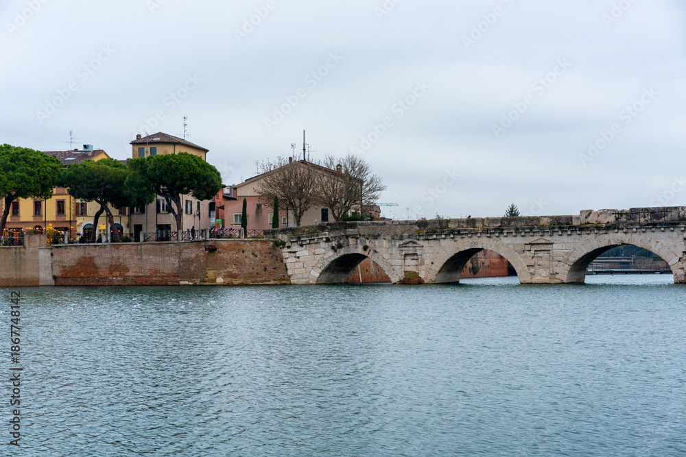 Obraz premium Tiberius ancient roman bridge spanning Marecchia river in Rimini