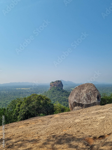 Iconic Sigiriya Rock surrounded by lush greenery. Sri Lanka.