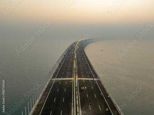 Aerial view of the Bandra-Worli Sea Link stretching across the hazy Arabian Sea, a modern marvel against the skyline, Mumbai, Maharashtra, India.