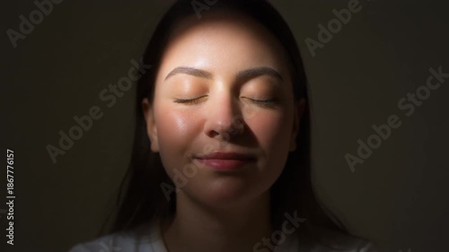 Woman portrait in dramatic lighting