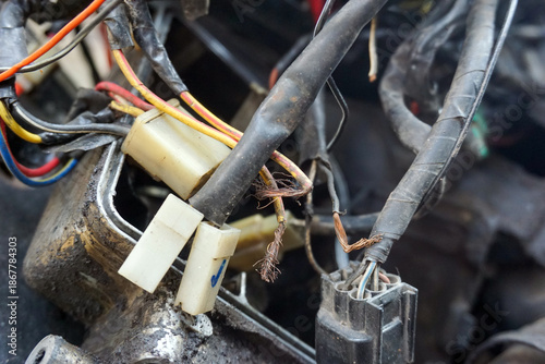 Fotografie damaged, dirty, and messy electrical cables and connectors from an old motorbike